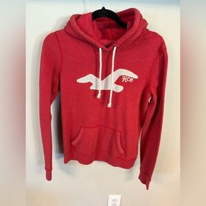 Women’s Hollister hoodie, red with sewn on logo, L